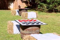 14 checkers and chess as gardne games and hay bales as chairs