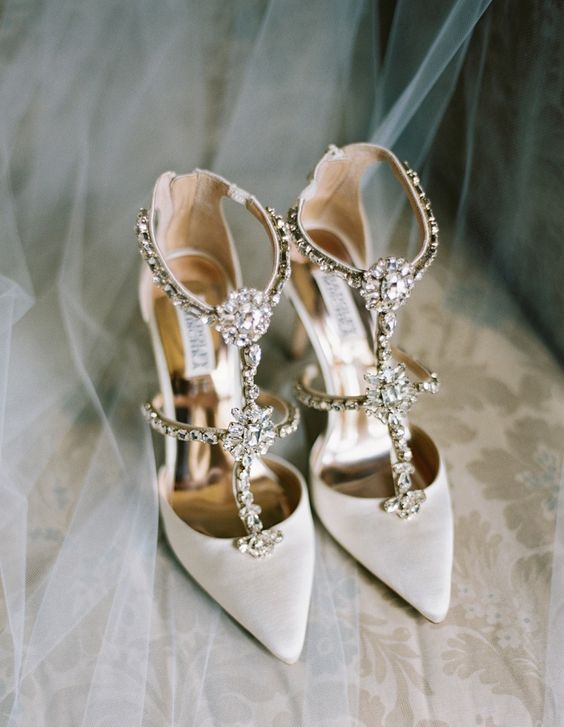 white strappy embellished wedding shoes are a bold and shiny option