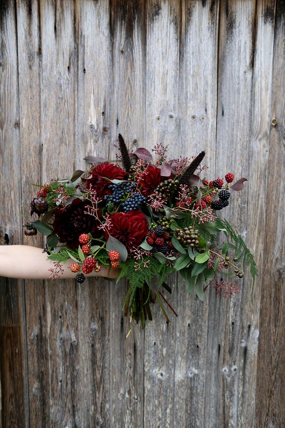 a burgundy and dark purple bouquet with black and navy touches for a moody bride