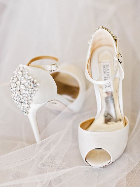 white peep toe wedding shoes with heavily embellished backs for a chic and shiny touch