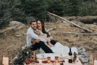 16 a simple natural setting for an elopement in the mountains, done with faux fur, evergreens and some pinecones