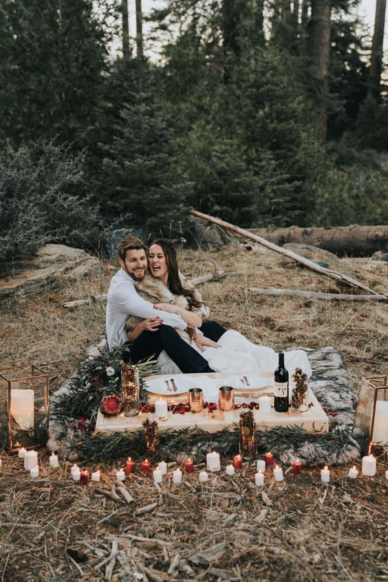 a simple natural setting for an elopement in the mountains, done with faux fur, evergreens and some pinecones