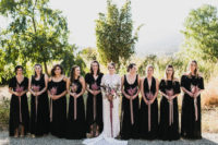 17 mismatching black bridesmaids’ maxi dresses plus pink bouquets look very chic