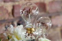 21 a light bulb cake topper with calligraphy is a creative idea for an industrial wedding