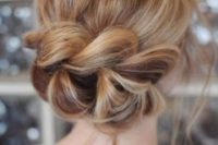 21 a low updo with a large braid instead of a chignon looks very eye-catchy and creative