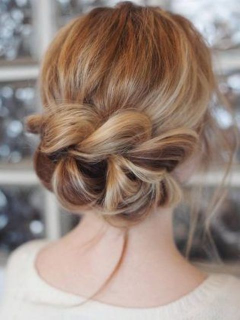 a low updo with a large braid instead of a chignon looks very eye-catchy and creative