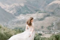 23 a flowy wedding dress will look amazing on a windy day and will provide you with wow pics