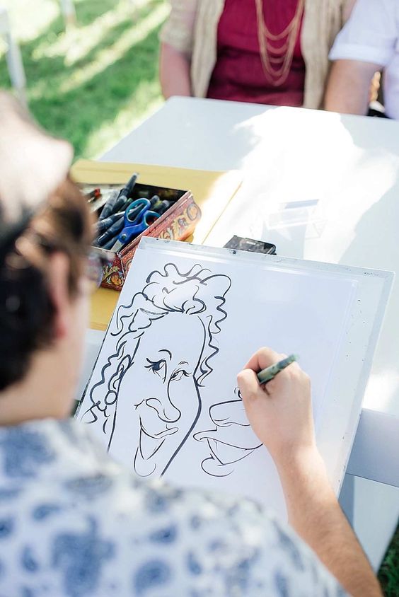 organize a sketch station for a caricaturist and you'll see a queue at it