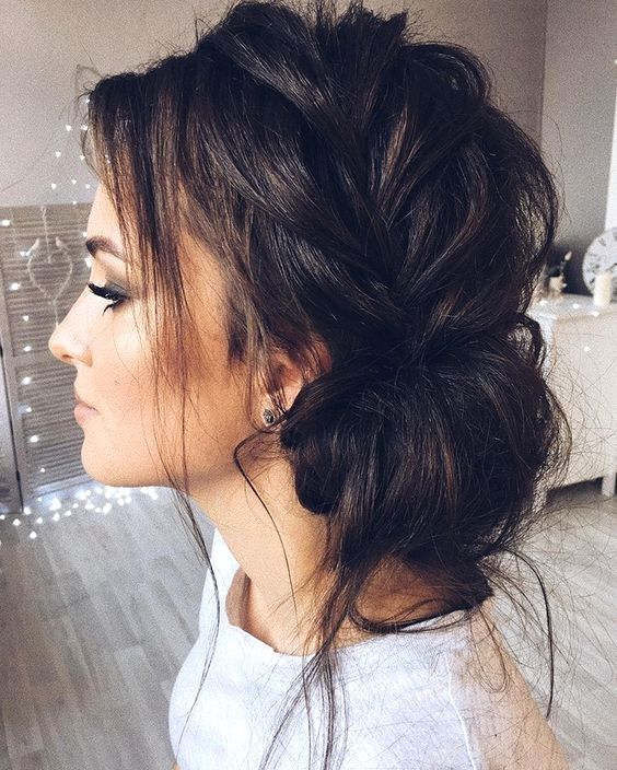 a messy side braided updo with locks down is a comfy and chic option