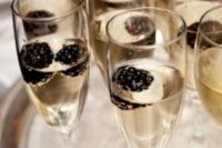 25 offer your gals champagne with blackberries as an elegant bridal shower drink with a Halloween touch