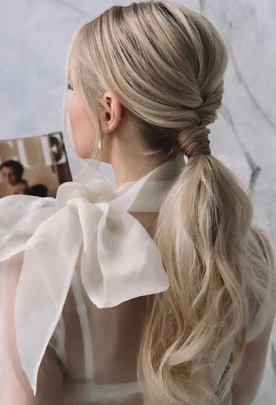 This big bun bridal hair is simple and classy - LoveweddingsNG