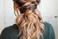 a beautiful low ponytail with twists and a wavy top is a beautiful way to show off your wavy locks at a boho wedding