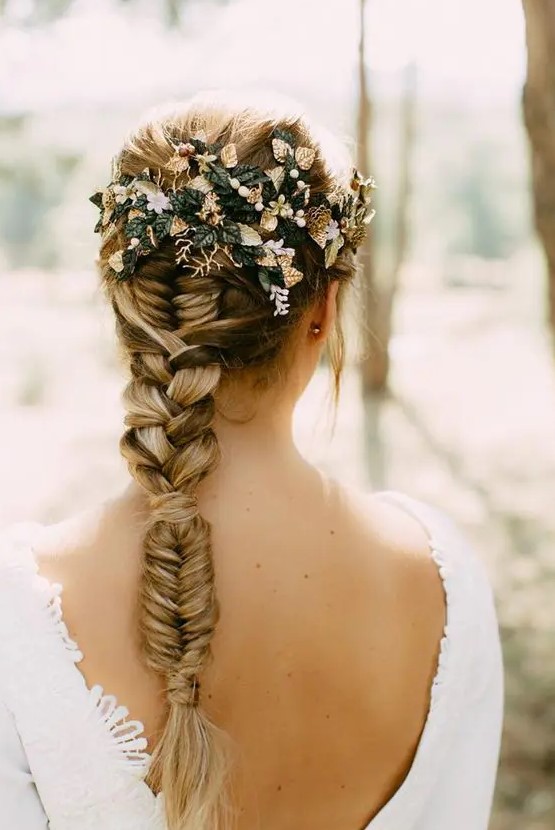 a creative wedding braid with a fishtail, then usual and then fishtail braid plus leaves decorating the back of the head is amazing