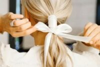 a lovely hairstyle with a ribbon hair wrap