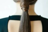 a sleek twisted low ponytail is a stylish idea for a modern or minimalist bride or bridesmaid