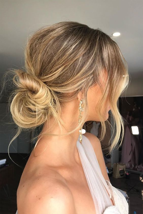 a super cool messy low bun with a bump on top and some locks down plus face-frmaing locks is a cool idea for a bridesmaid