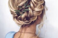 an updo with a bump and a dimensional side braid plus some locks down is a chic idea
