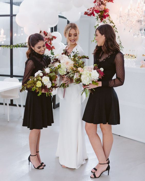 Black knee length polka dot dresses with pleated skirts and black shoes are great for a modern wedding