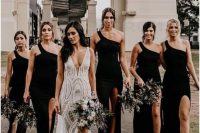 lovely maxi black bridesmaid dresses with thigh high slits an one shoulder necklines, black shoes for a boho wedding