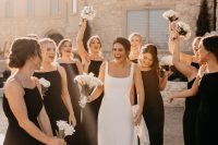 matching black maxi bridesmaid dresses with high necklines and spaghetti straps are gorgeous for a modern wedding