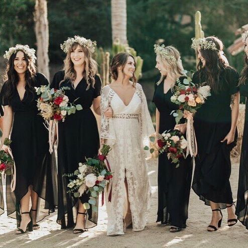 Maxi black bridesmaid dresses with V necklines and short sleeves are very cool for a boho wedding in the fall or winter