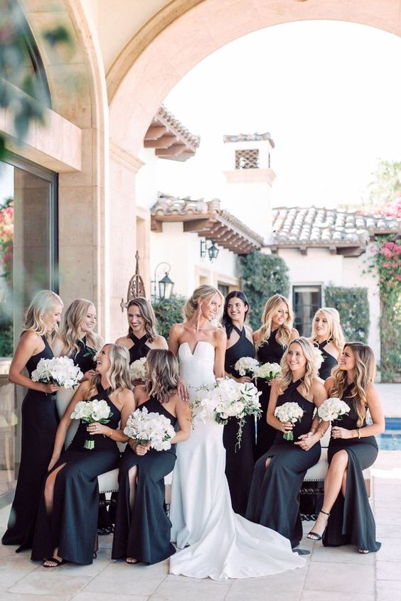 maxi black bridesmaid dresses with front slits and halter necklines are amazing for a chic and elegant wedding