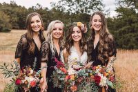 maxi black bridesmaid dresses with lace sleeves and V-necklines are perfect for a fall boho wedding