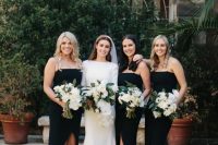 midi black bridesmaid dresses with spaghetti straps and black strappy shoes for a modenr or minimalist wedding