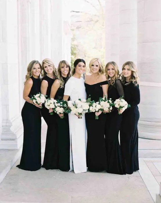 mismatched black bridesmaids' maxi dresses and a modern bride in crispy white