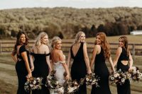 mismatched maxi black bridesmaid dresses with mermaid silhouettes are amazing for a chic boho wedding