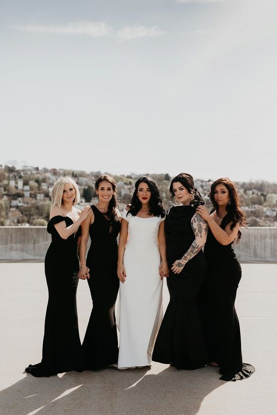 mismatching and very refined black maxi bridesmaid dresses with trains are gorgeous and sophisticated