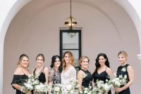 mismatching black maxi bridesmaid dresses including a floral applique one are amazing for a cool and chic wedding