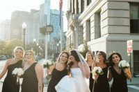 mismatching maxi black bridesmaid dresses with straps and one shoulder ones, with slits and neutral shoes for a chic summer wedding