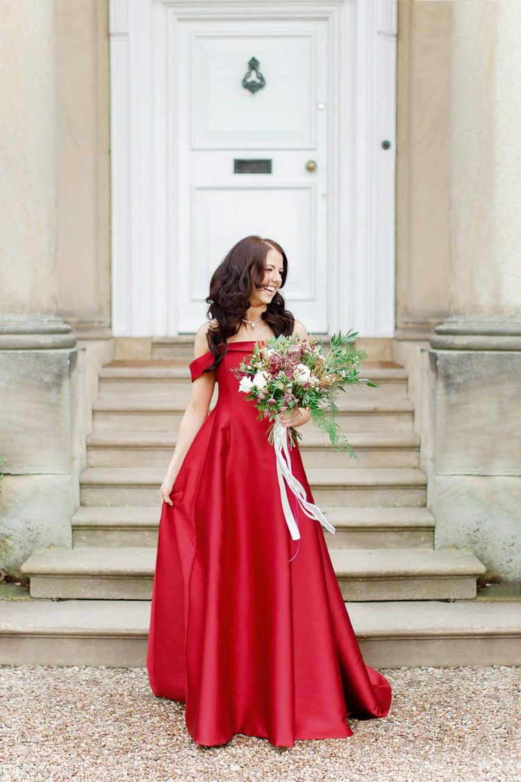 The bride chose a fantastic red off the shoulder A-line wedding dress that made a statement