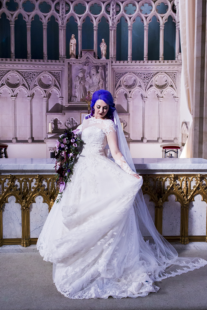 The bride was wearing a gorgeous lace princess-style wedding gown with illusion sleeves and a neckline