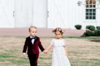 03 The flower girl was rocking a white lace maxi dress, and the ring bearer was wearing a maroon velvet suit