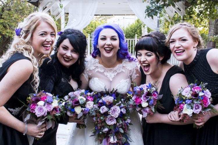 Her bridesmaids were wearing mismatching black dresses of their choice