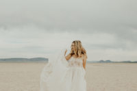 04 The bride was wearing an airy boho lace wedding gown on spaghetti straps with an A-line skirt