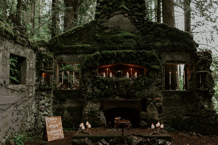 The wedding altar was a gorgeous one, with an antique hearth covered with moss and decorated with candles all around