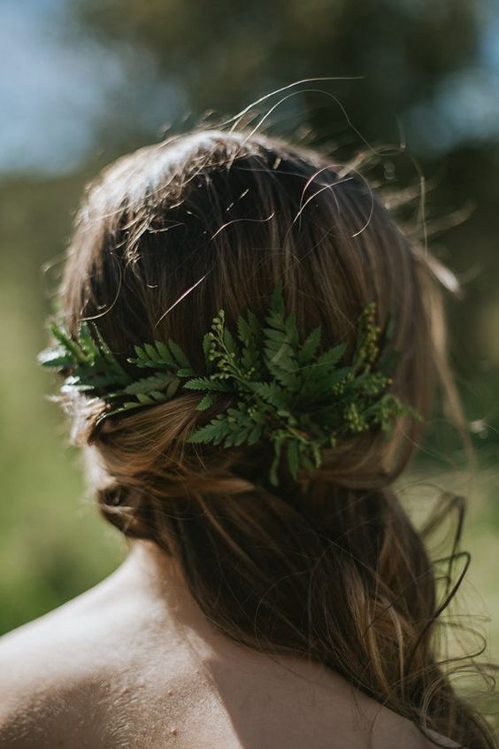 side-swept loose curls and a touch of fern are ideal for a woodland bride