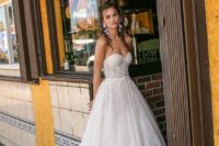 04 strapless A-line wedding gown with lace and a touch of sparkle, with a sweetheart neckline and a train for a wow look