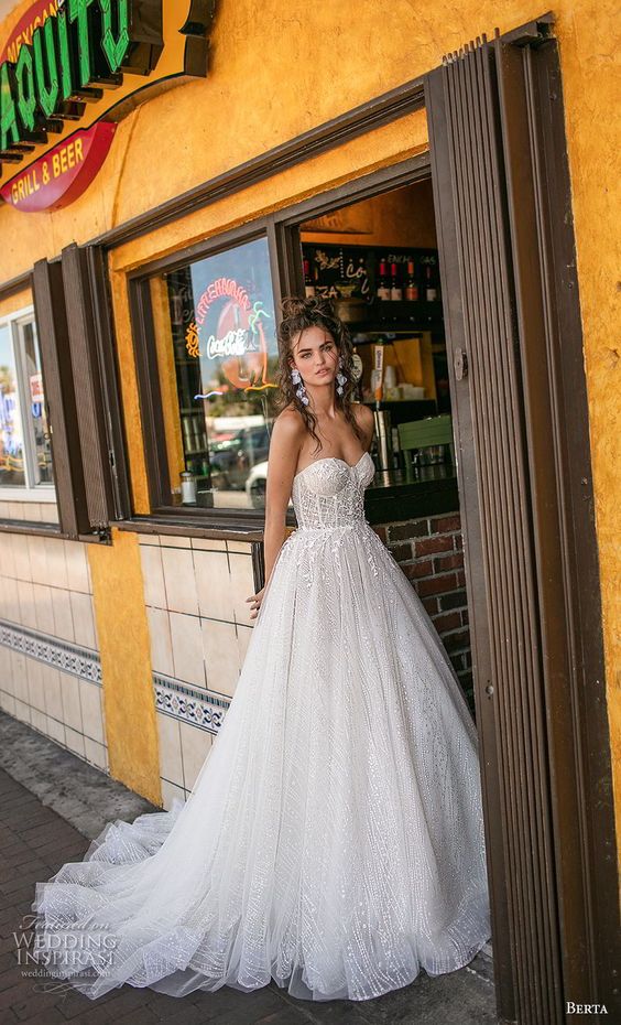 strapless A-line wedding gown with lace and a touch of sparkle, with a sweetheart neckline and a train for a wow look