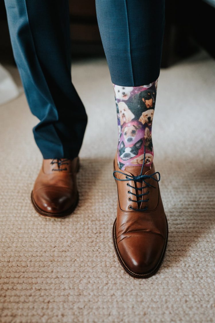 He highlighted his look with dog printed socks for a fun touch