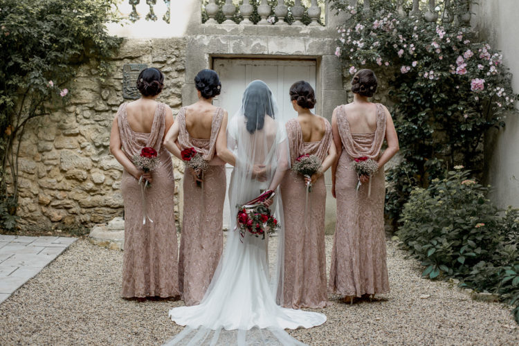 The bridesmaids were rocking blush pink dresses with delicate beding and a cowl back