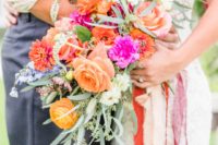 05 The wedding bouquet was done with pink, purple, orange, yellow blooms and textural greenery