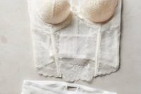 05 a chic white Chantilly lace bridal lingerie set with a bustier and panties with sheer parts