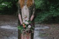 05 a neutral wedding dress with pink floral embroidery and a dark grene lace coverup with a train