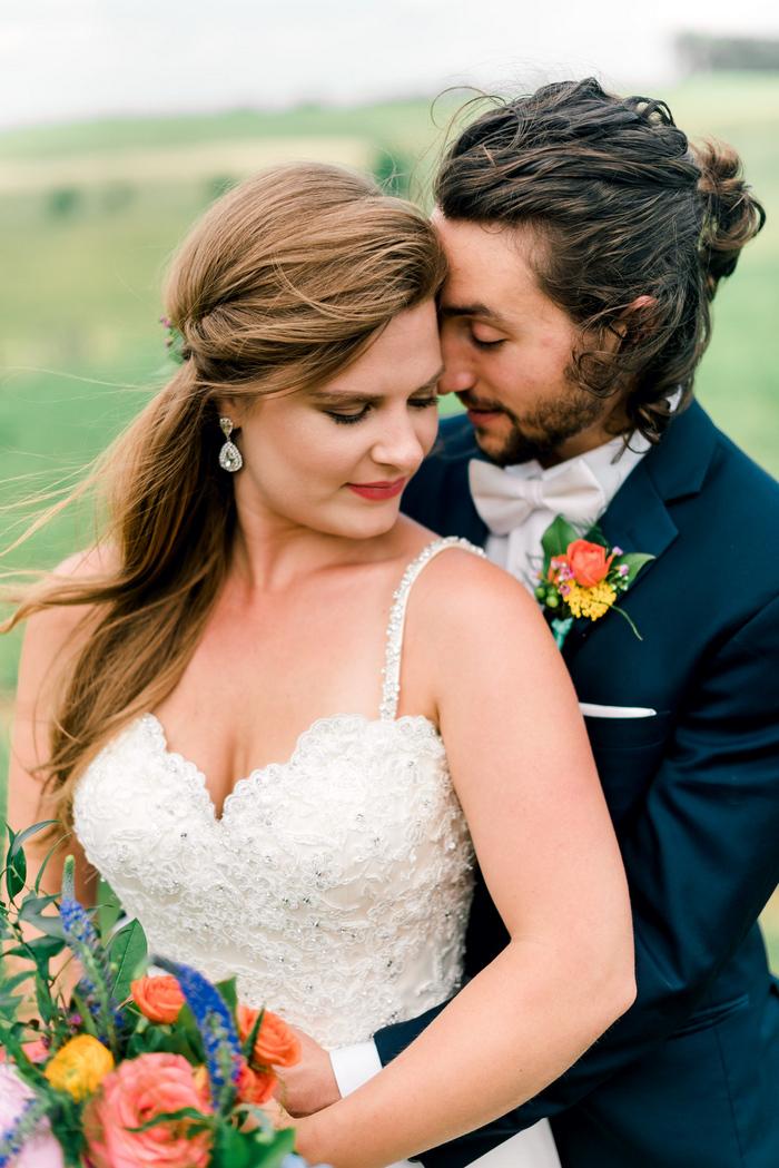 The bride was wearing statement earrings, and the groom rocked a trendy hairstyle