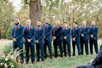 06 The groomsmen were rocking navy suits with blue shirts and bold plum-colored ties