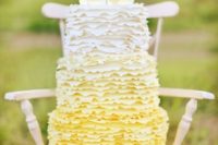 06 a fun ombre yellow ruffle wedding cake topped with mason jars with lemonade for a rustic wedding